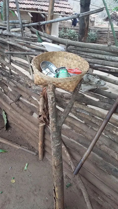 A storage basket in the yard of a Madia family